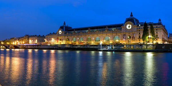 Orsay Museum building from the Seine at night.