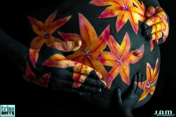 Orange flowers on black background.